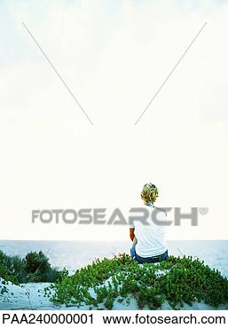 Stock Photography - woman looking 
out to sea, rear 
view. fotosearch 
- search stock 
photos, pictures, 
images, and photo 
clipart