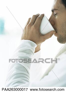 Picture - man drinking from 
cup, eyes closed. 
fotosearch - search 
stock photos, 
pictures, images, 
and photo clipart