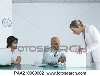 Stock Photo - woman at computer 
with headset sitting 
next to businessman 
signing. fotosearch 
- search stock 
photos, pictures, 
images, and photo 
clipart