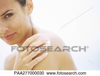 Stock Photography - woman applying 
sunscreen to shoulder, 
partial view. 
fotosearch - search 
stock photos, 
pictures, images, 
and photo clipart