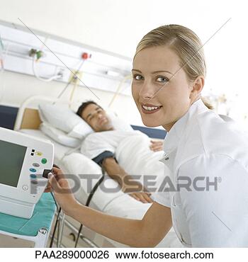 Stock Photo - nurse checking 
patient's monitor. 
fotosearch - search 
stock photos, 
pictures, images, 
and photo clipart