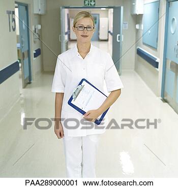 Stock Photography - nurse standing 
in hospital corridor. 
fotosearch - search 
stock photos, 
pictures, images, 
and photo clipart