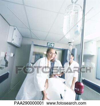 Stock Photography - medical team pushing 
patient on gurney. 
fotosearch - search 
stock photos, 
pictures, images, 
and photo clipart