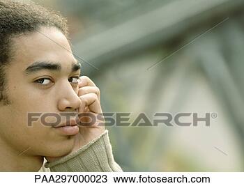 Stock Photo - young man using 
cell phone, close-up. 
fotosearch - search 
stock photos, 
pictures, images, 
and photo clipart