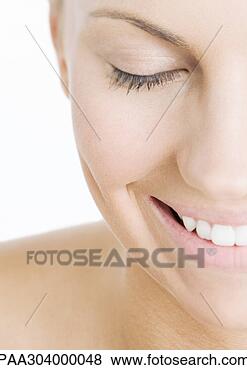 Stock Photo - woman with eyes 
closed smiling, 
close-up. fotosearch 
- search stock 
photos, pictures, 
images, and photo 
clipart