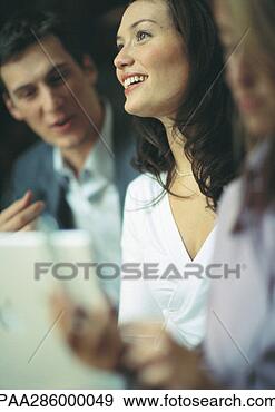 Stock Photograph - businesswoman 
smiling between 
two co-workers. 
fotosearch - search 
stock photos, 
pictures, images, 
and photo clipart