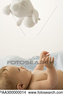 Stock Photo - baby looking up 
at toy. fotosearch 
- search stock 
photos, pictures, 
images, and photo 
clipart
