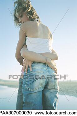Stock Photography - two children standing 
on beach, embracing. 
fotosearch - search 
stock photos, 
pictures, images, 
and photo clipart