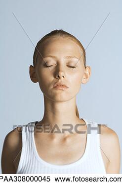 Stock Image - woman with eyes 
closed wearing 
tank top, portrait. 
fotosearch - search 
stock photos, 
pictures, images, 
and photo clipart