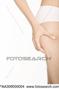 Stock Photo - woman squeezing 
fat on hip. fotosearch 
- search stock 
photos, pictures, 
images, and photo 
clipart