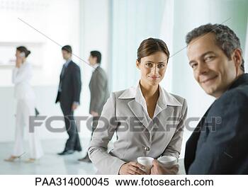 Stock Image - business colleagues 
having coffee 
break in lobby. 
fotosearch - search 
stock photos, 
pictures, images, 
and photo clipart