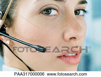 Stock Photo - woman wearing 
headset, close-up. 
fotosearch - search 
stock photos, 
pictures, images, 
and photo clipart