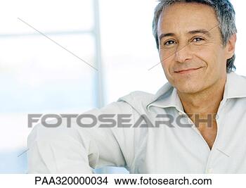 Stock Photo - mid-adult man 
smiling, portrait. 
fotosearch - search 
stock photos, 
pictures, images, 
and photo clipart