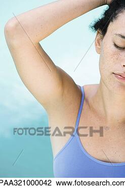 Stock Photo - young woman with 
hand behind head, 
partial view. 
fotosearch - search 
stock photos, 
pictures, images, 
and photo clipart
