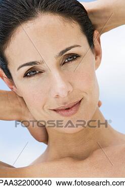 Stock Photography - woman with hands 
behind head, portrait. 
fotosearch - search 
stock photos, 
pictures, images, 
and photo clipart