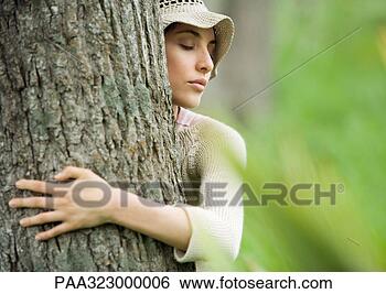 Stock Photo - woman hugging 
tree. fotosearch 
- search stock 
photos, pictures, 
images, and photo 
clipart