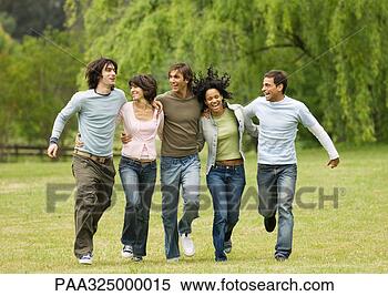 Stock Image - group of young 
friends with arms 
around each other, 
 skipping across. 
fotosearch - search 
stock photos, 
pictures, images, 
and photo clipart