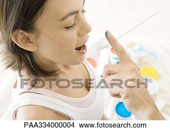 Stock Photo - man's finger reaching 
towards woman's 
nose with drop 
of paint. fotosearch 
- search stock 
photos, pictures, 
images, and photo 
clipart