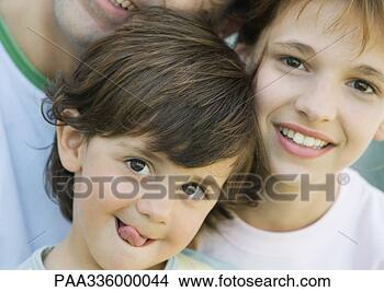Stock Photo - father with two 
children,  boy 
sticking out tongue, 
 girl and father. 
fotosearch - search 
stock photos, 
pictures, images, 
and photo clipart