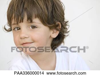 Stock Photo - mischievous boy 
looking at camera, 
portrait, close-up. 
fotosearch - search 
stock photos, 
pictures, images, 
and photo clipart