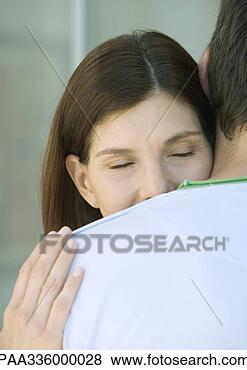 Stock Photo - woman with head 
on man's shoulder, 
closed eyes, partial 
view. fotosearch 
- search stock 
photos, pictures, 
images, and photo 
clipart