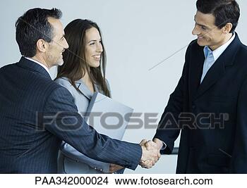Stock Photo - business executives 
shaking hands. 
fotosearch - search 
stock photos, 
pictures, images, 
and photo clipart