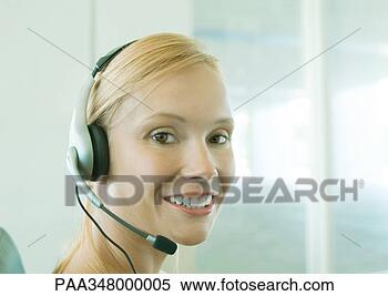 Stock Image - woman wearing 
headset. fotosearch 
- search stock 
photos, pictures, 
images, and photo 
clipart