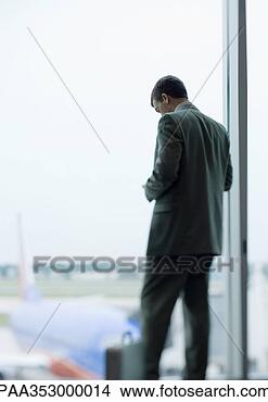 man-standing-looking_~PAA353000014.jpg