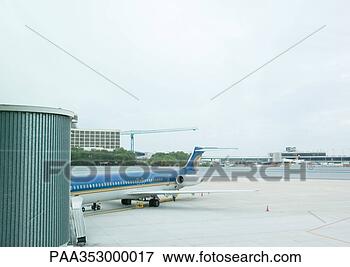 Picture - plane parked at 
departure gate. 
fotosearch - search 
stock photos, 
pictures, images, 
and photo clipart