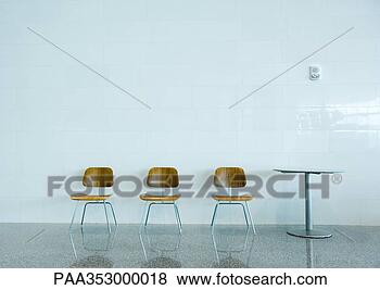 Stock Photo - three chairs in 
a row and a table. 
fotosearch - search 
stock photos, 
pictures, images, 
and photo clipart