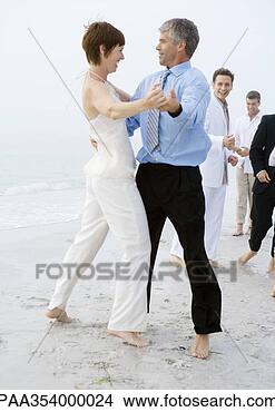 Stock Photo - people in formalwear 
dancing on beach. 
fotosearch - search 
stock photos, 
pictures, images, 
and photo clipart