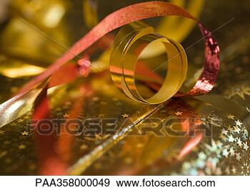 Stock Photograph - christmas gift, 
extreme close-up. 
fotosearch - search 
stock photos, 
pictures, images, 
and photo clipart