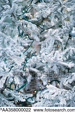 Stock Photo - christmas tree 
covered with lights, 
partial view. 
fotosearch - search 
stock photos, 
pictures, images, 
and photo clipart