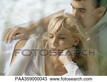Stock Photo - couple lying down 
together, eyes 
shut. fotosearch 
- search stock 
photos, pictures, 
images, and photo 
clipart