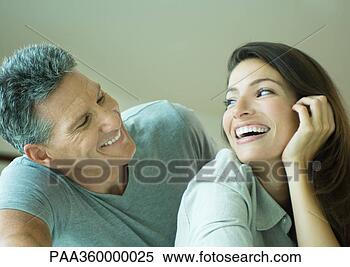 Stock Image - couple smiling 
at each other, 
head and shoulders. 
fotosearch - search 
stock photos, 
pictures, images, 
and photo clipart