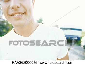 Stock Photo - young man, cropped 
view of head and 
shoulders. fotosearch 
- search stock 
photos, pictures, 
images, and photo 
clipart