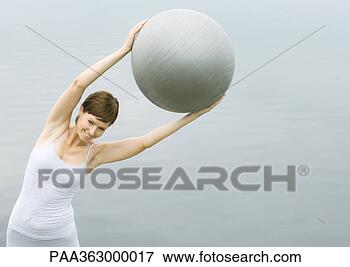 Picture - woman working 
out with fitness 
ball. fotosearch 
- search stock 
photos, pictures, 
images, and photo 
clipart