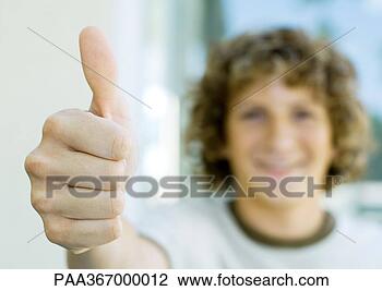 Stock Photo - preteen boy giving 
thumbs up. fotosearch 
- search stock 
photos, pictures, 
images, and photo 
clipart
