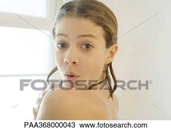 Stock Photo - preteen girl in 
shower, looking 
over shoulder 
at camera. fotosearch 
- search stock 
photos, pictures, 
images, and photo 
clipart