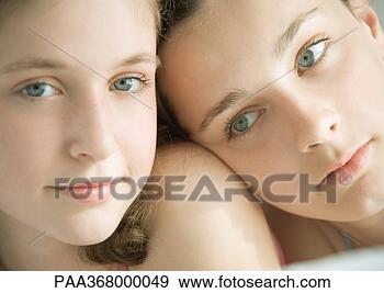 Stock Photograph - two preteen girls, 
one with head 
on other's shoulder. 
fotosearch - search 
stock photos, 
pictures, images, 
and photo clipart