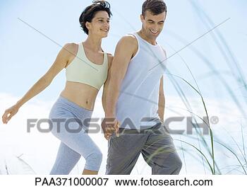 Picture - couple walking 
in exercise clothes. 
fotosearch - search 
stock photos, 
pictures, images, 
and photo clipart