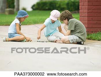 Stock Photo - children playing 
marbles in street. 
fotosearch - search 
stock photos, 
pictures, images, 
and photo clipart