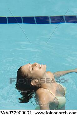 Stock Photography - woman standing 
in pool with head 
back and eyes 
closed. fotosearch 
- search stock 
photos, pictures, 
images, and photo 
clipart