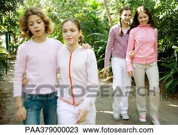 Stock Photo - preteen girls 
walking on path. 
fotosearch - search 
stock photos, 
pictures, images, 
and photo clipart