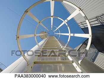 Stock Photography - safety ladder 
in industrial 
area, view from 
directly underneath. 
fotosearch - search 
stock photos, 
pictures, images, 
and photo clipart