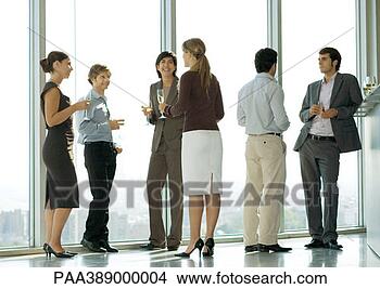 Stock Photo - people standing 
with glasses during 
office party. 
fotosearch - search 
stock photos, 
pictures, images, 
and photo clipart