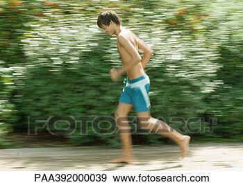 Stock Photograph - boy in swimming 
trunks running. 
fotosearch - search 
stock photos, 
pictures, images, 
and photo clipart