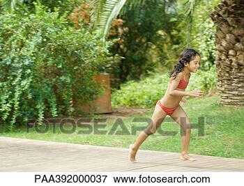 Picture - girl in bathing 
suit running in 
back yard. fotosearch 
- search stock 
photos, pictures, 
images, and photo 
clipart