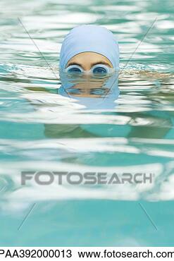 Stock Photo - person in swimming 
pool wearing bathing 
cap and goggles. 
fotosearch - search 
stock photos, 
pictures, images, 
and photo clipart