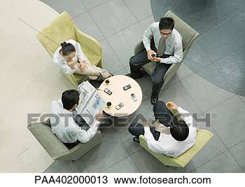 Stock Photo - executives sitting 
in lobby, view 
from directly 
above. fotosearch 
- search stock 
photos, pictures, 
images, and photo 
clipart